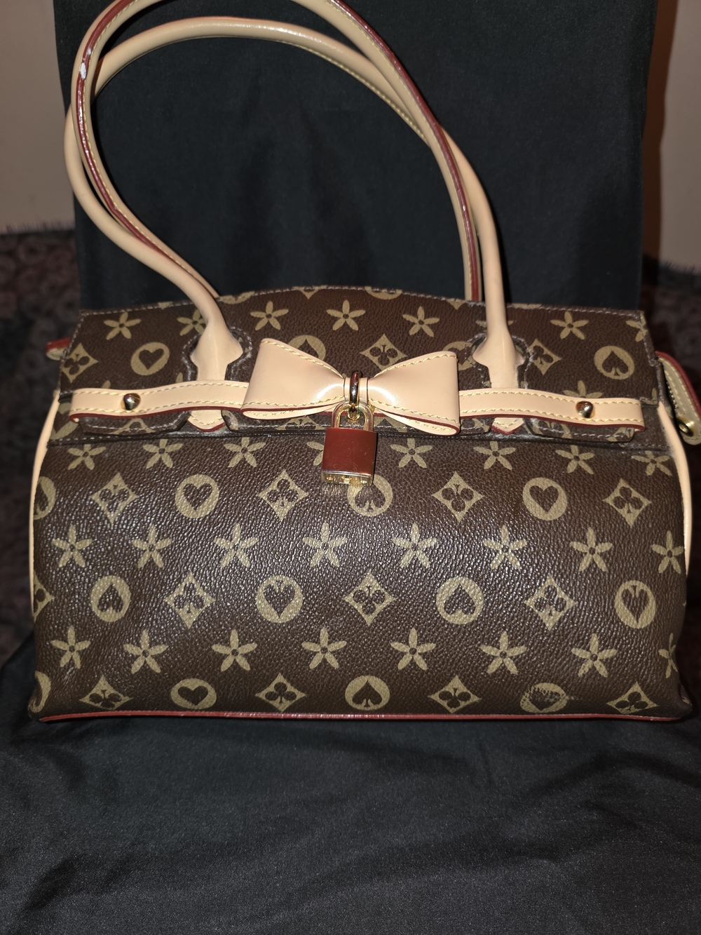 Brown Patterned Satchel with Cream Trim and Bow Accent